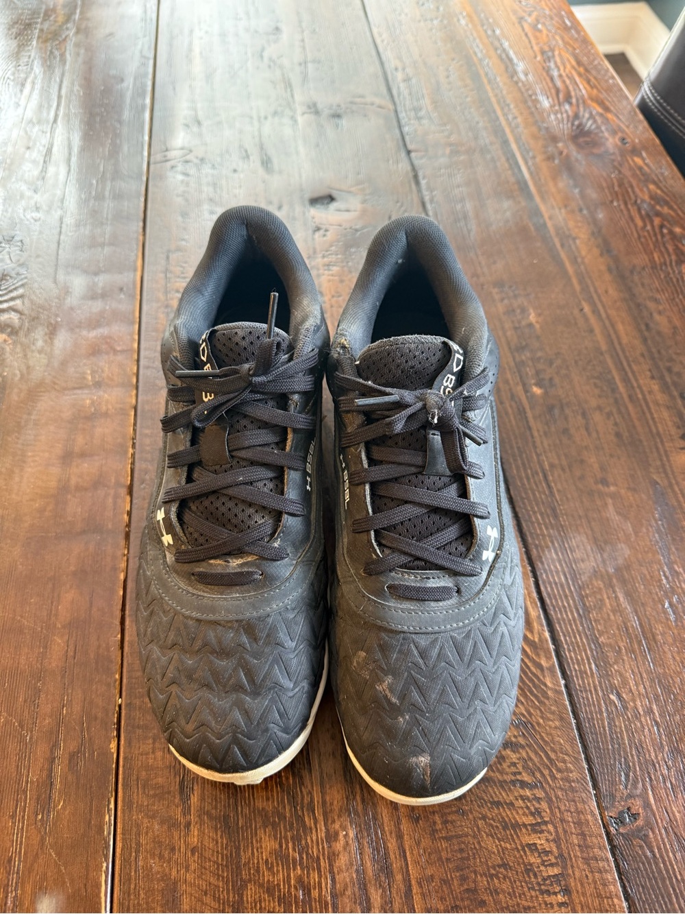 Under Armour Men's Black Baseball Cleats with Subtle White Accents